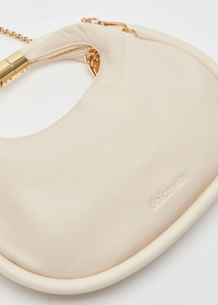 Dolce Vita Keena Convertible Wristlet Bag- Ivory-Hand In Pocket