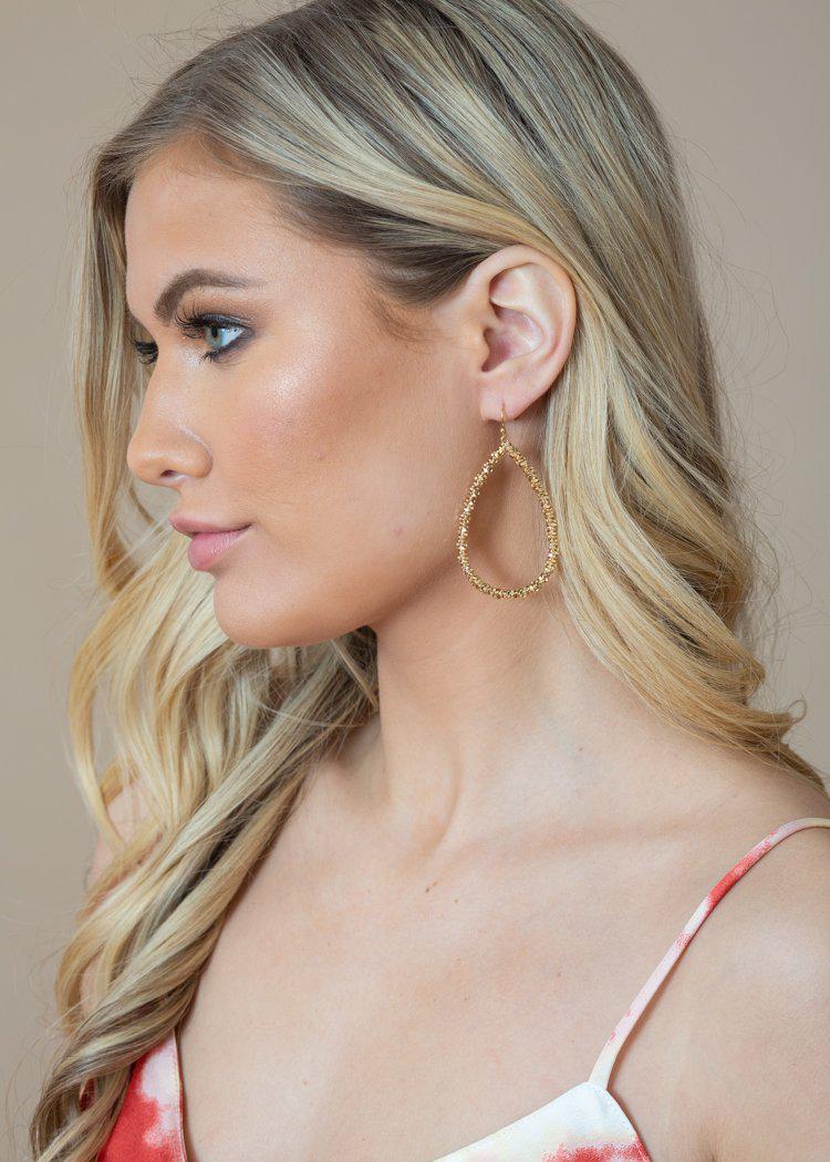 Yunque Teardrop Textured Gold Hoops-Hand In Pocket