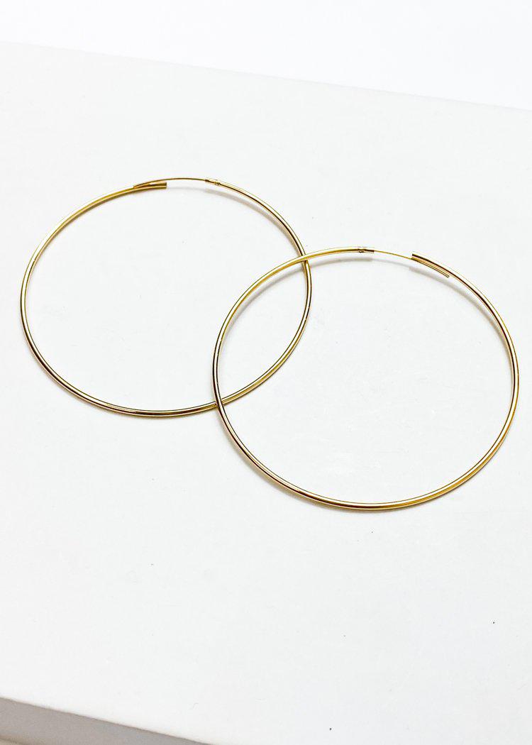 Khloe Thin Oversized Gold Hoops-Hand In Pocket