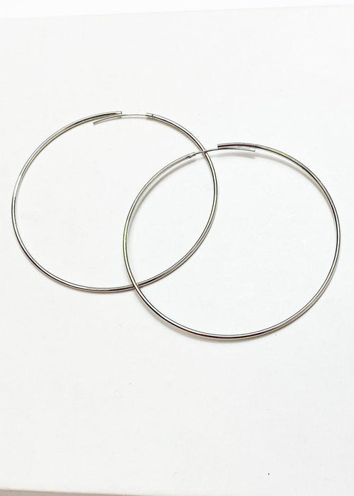 Khloe Thin Oversized Silver Hoops-Hand In Pocket