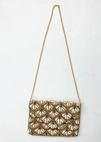 Jakarta Puka Shell Clutch-Hand In Pocket