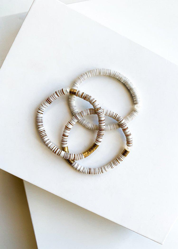 White and Gold Cardiff Disc Beaded Stretch Bracelet-Hand In Pocket