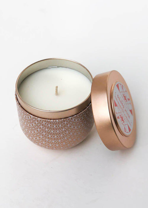 Capri Blue Gilded Muse Pink Grapefuit and Prosecco Tin Candle-Hand In Pocket