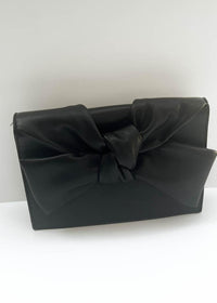 Samantha Bow Clutch-Hand In Pocket