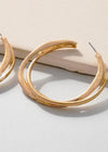 Nora Twisted Hoop-Gold-Hand In Pocket